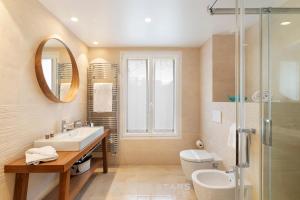 a bathroom with a sink and a toilet and a shower at Villa Artemys - Five Stars Holiday House in Saint-Jean-Cap-Ferrat +37 photos
