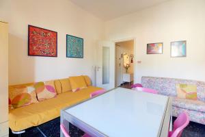a living room with a couch and a table at Borgomare in Finale Ligure