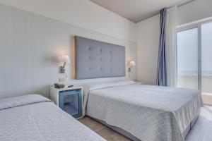 Postel nebo postele na pokoji v ubytování Hotel Austria