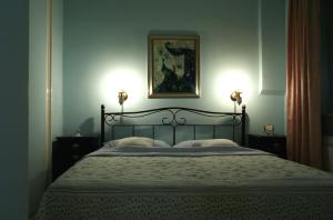 a bedroom with a bed with two lamps on it at Apartments ABA Zagreb in Zagreb