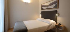 Postel nebo postele na pokoji v ubytování Albergo Centrale