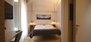 Postel nebo postele na pokoji v ubytování Albergo Centrale