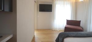 TV a/nebo společenská místnost v ubytování Albergo Centrale