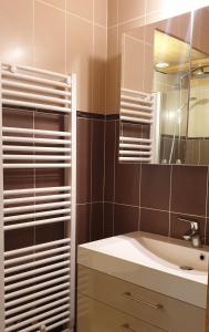 a bathroom with a sink and a mirror at La Courtine 3 in Verchaix