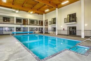 a pool with blue water in a large building at Econo Lodge Waupaca in Waupaca