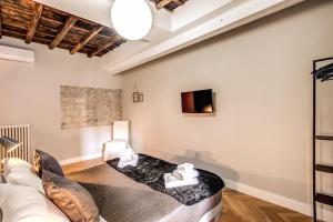 Posteľ alebo postele v izbe v ubytovaní Trevi Fountain Superior 3 bdr apartment