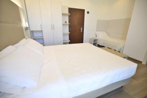 Postel nebo postele na pokoji v ubytování Hotel Villa Sole Resort
