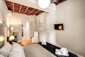 Posteľ alebo postele v izbe v ubytovaní Trevi Fountain Superior 3 bdr apartment