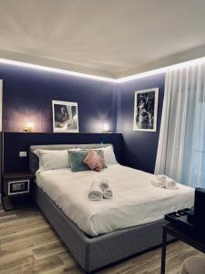 Кровать или кровати в номере Dimora del Teatro