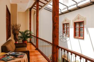 a living room with a couch and a table at Santa Lucia House - Forum in Cuenca