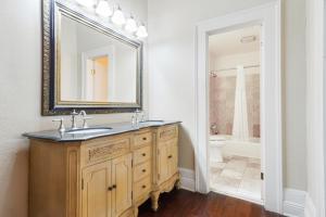 a bathroom with a sink and a mirror and a toilet at Andrew Jackson Hotel French Quarter in New Orleans +51 photos
