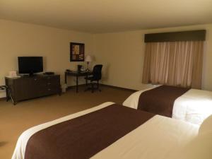 Postel nebo postele na pokoji v ubytování Villegiature Deux Rivieres Resort + 37 fotografií