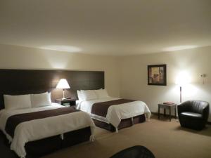 Voodi või voodid majutusasutuse Villegiature Deux Rivieres Resort toas