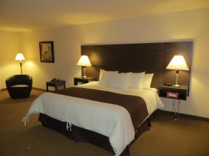 Voodi või voodid majutusasutuse Villegiature Deux Rivieres Resort toas