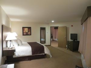 Voodi või voodid majutusasutuse Villegiature Deux Rivieres Resort toas