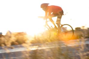 a person riding a bike on the road at Hotell Persnäs in Persnäs
