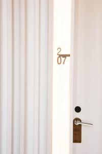 a door with a number on it next to a window at Aroeira Lisbon Hotel - Sea & Golf in Aroeira