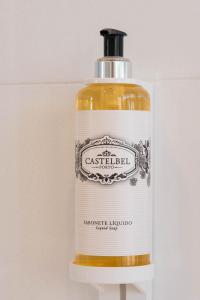 a bottle of soap with a white label on it at Aroeira Lisbon Hotel - Sea & Golf in Aroeira