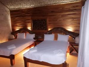 Postel nebo postele na pokoji v ubytování Cabañas la finca 2