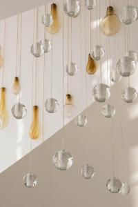 a bunch of glass balls hanging from a ceiling at Aroeira Lisbon Hotel - Sea & Golf in Aroeira