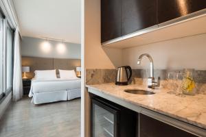 Katil atau katil-katil dalam bilik di Vivaldi Hotel Loft Punta Carretas