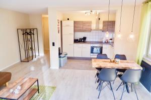 a kitchen and dining room with a table and chairs at City Flair in Dresden