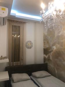 A bed or beds in a room at Synagogue Gozsdu Private Apartments