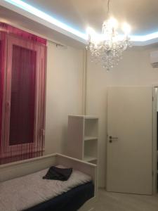 A bed or beds in a room at Synagogue Gozsdu Private Apartments