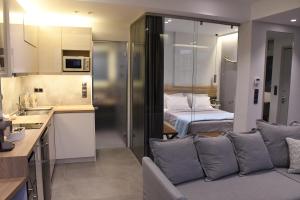 A kitchen or kitchenette at ATHENS PHOS Brand New Loft in Historical Athens Historical Center