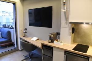 A kitchen or kitchenette at ATHENS PHOS Brand New Loft in Historical Athens Historical Center