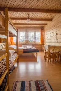 En eller flere senge i et værelse på Góralski dom Murzańskich