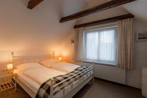 Postel nebo postele na pokoji v ubytování stadthaus husum