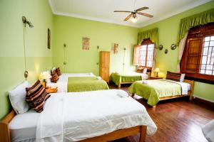 Cama ou camas em um quarto em Lima Wari Hotel Boutique