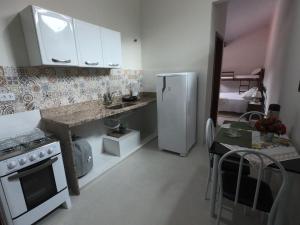 Kuchyň nebo kuchyňský kout v ubytování Recanto Guarassol Apartamentos