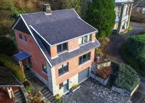 an aerial view of a brick house with a roof at "En Aqualye" chambre privative chez l'habitant in Aywaille