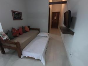 TV a/nebo společenská místnost v ubytování Recanto Guarassol Apartamentos