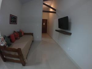 TV a/nebo společenská místnost v ubytování Recanto Guarassol Apartamentos