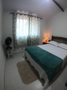 Postel nebo postele na pokoji v ubytování Recanto Guarassol Apartamentos