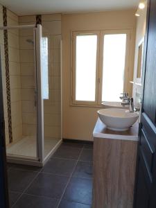 a bathroom with a sink and a shower at Holiday Home Maison de l'Océan à Denneville in Denneville +30 photos