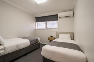 Postel nebo postele na pokoji v ubytování Seabrook Hotel