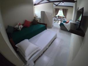 Postel nebo postele na pokoji v ubytování Recanto Guarassol Apartamentos