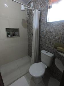 Koupelna v ubytování Recanto Guarassol Apartamentos