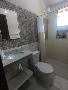 Koupelna v ubytování Recanto Guarassol Apartamentos
