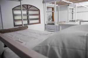 Ένα ή περισσότερα κρεβάτια σε δωμάτιο στο Manaca Hospedaria