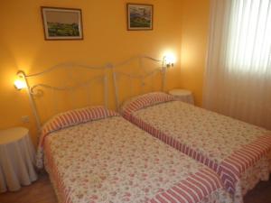 A bed or beds in a room at Residencial Peñiscola Playa 6 LEK