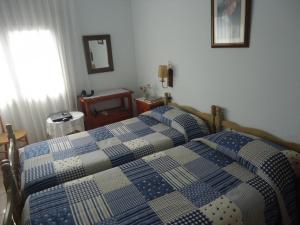 A bed or beds in a room at Residencial Peñiscola Playa 6 LEK