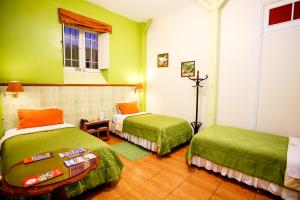 Cama ou camas em um quarto em Lima Wari Hotel Boutique