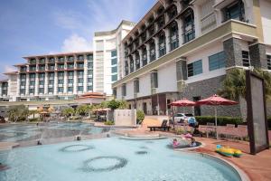 a large swimming pool in front of a hotel at Ancasa Royale, Pekan Pahang by Ancasa Hotels & Resorts in Pekan