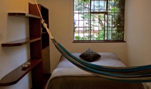 Postel nebo postele na pokoji v ubytování Casa Muntú - La Candelaria
