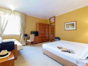 Postel nebo postele na pokoji v ubytování Ibis Styles Bari Giovinazzo